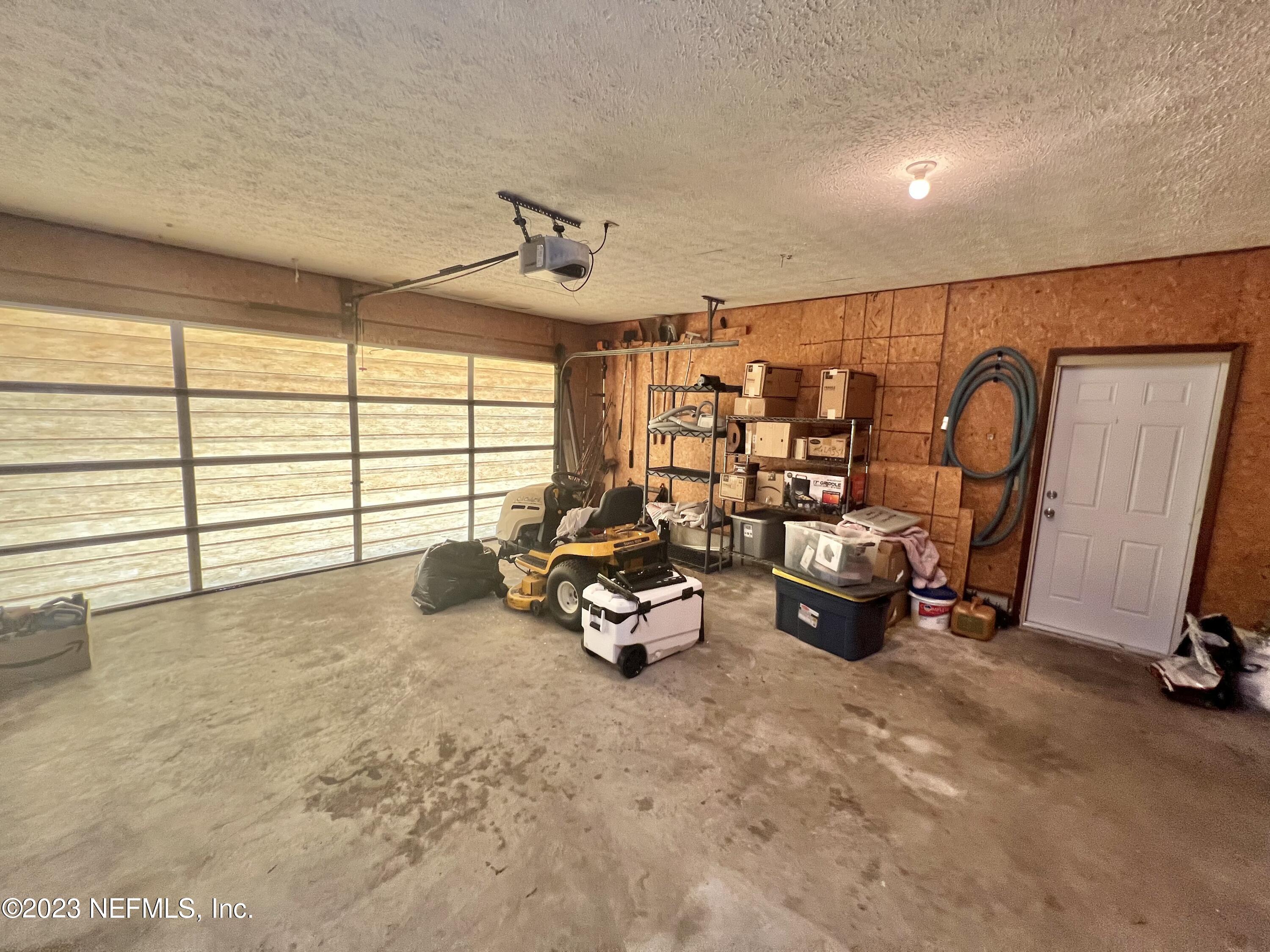 210 Prince Road St. Augustine, FL 32086 - Photo 38 of 43 a room with gym equipment and a large window