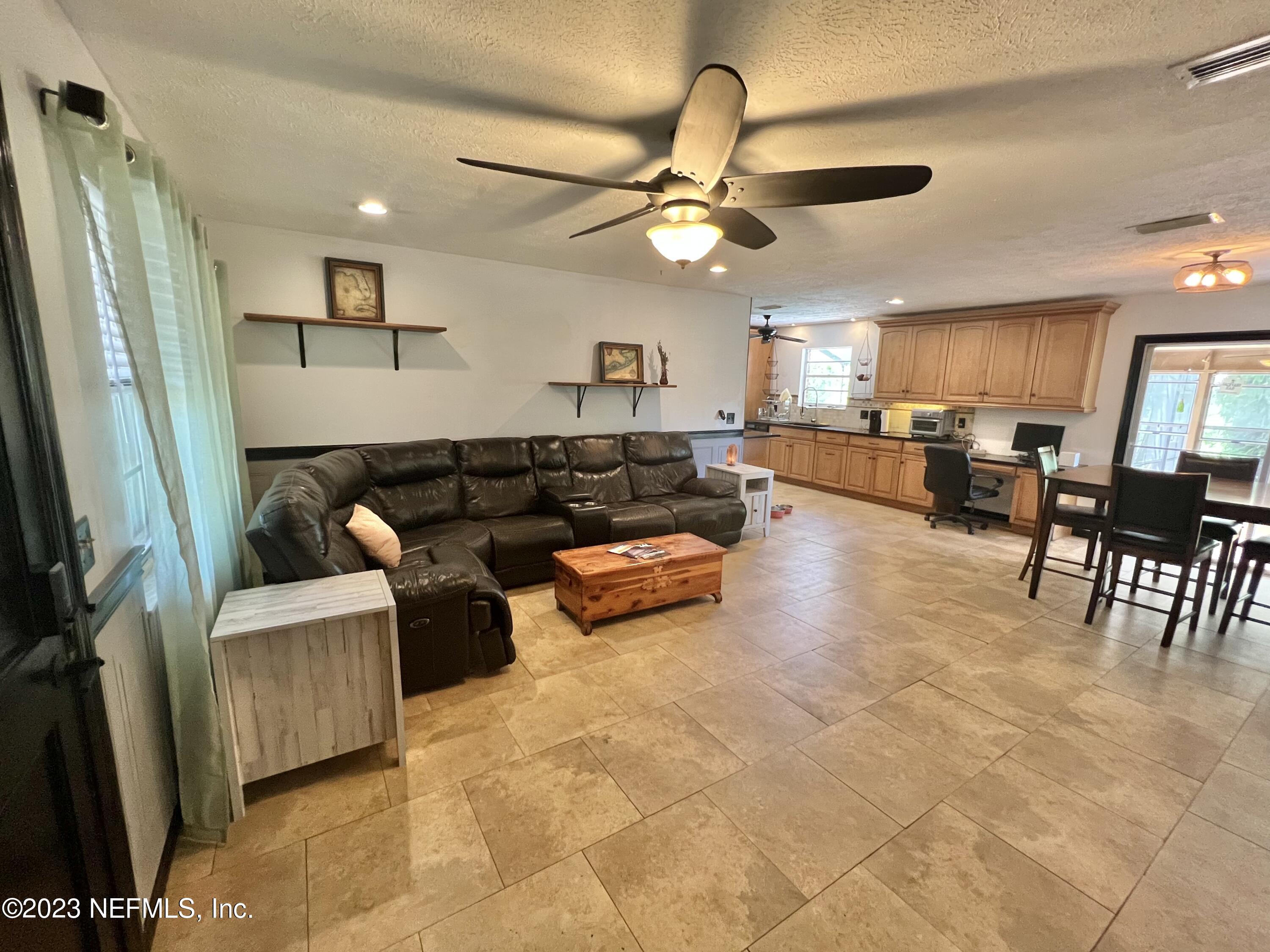 210 Prince Road St. Augustine, FL 32086 - Photo 5 of 43 a living room with furniture and a large window
