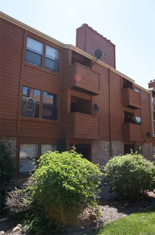 a brick building with a yard