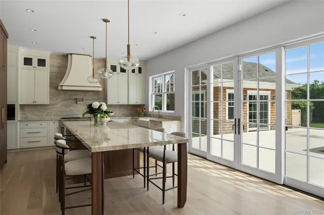 a view of a a dining room with furniture window and wooden floor