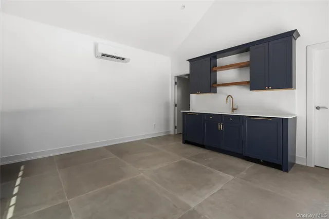 a room with cabinets and sink