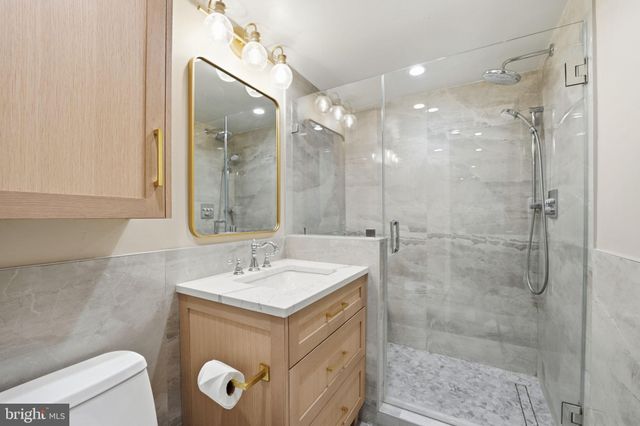 a spacious bedroom with a large bed and a window