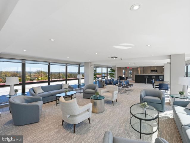 a kitchen with kitchen island a sink stove and refrigerator