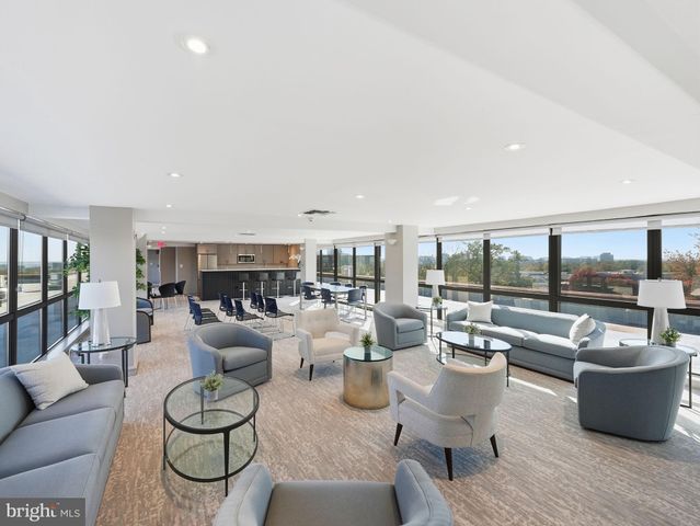 a kitchen with stainless steel appliances a sink stove and refrigerator