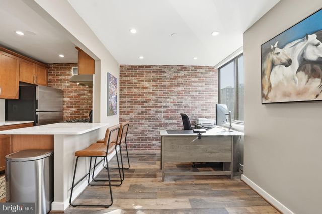 a dining room with table chairs and entryway