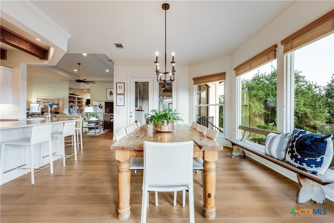 1307 Osprey Ridge Loop Lago Vista, TX 78645 - Photo 11 of 40 a view of a dining room with furniture window and wooden floor