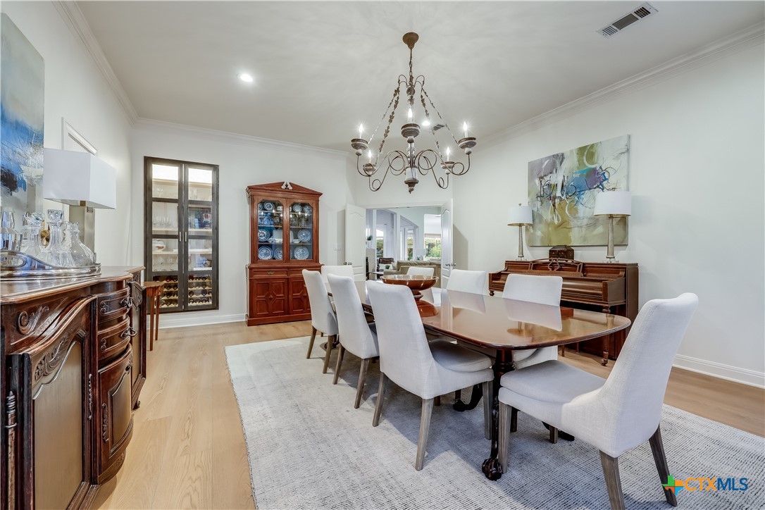 1307 Osprey Ridge Loop Lago Vista, TX 78645 - Photo 13 of 40 a view of a dining room with furniture