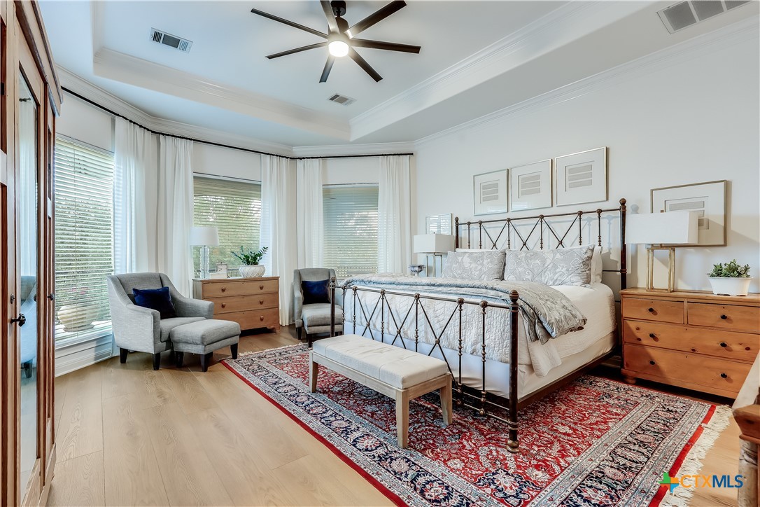 1307 Osprey Ridge Loop Lago Vista, TX 78645 - Photo 14 of 40 a bedroom with furniture and windows