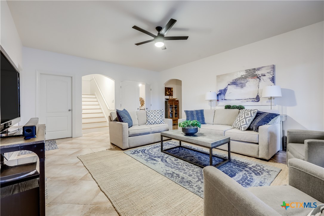 1307 Osprey Ridge Loop Lago Vista, TX 78645 - Photo 19 of 40 a living room with furniture and a flat screen tv