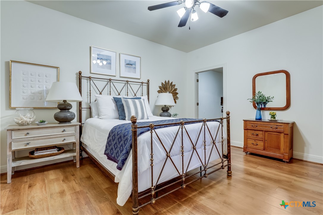 1307 Osprey Ridge Loop Lago Vista, TX 78645 - Photo 26 of 40 a bedroom with furniture and a dresser