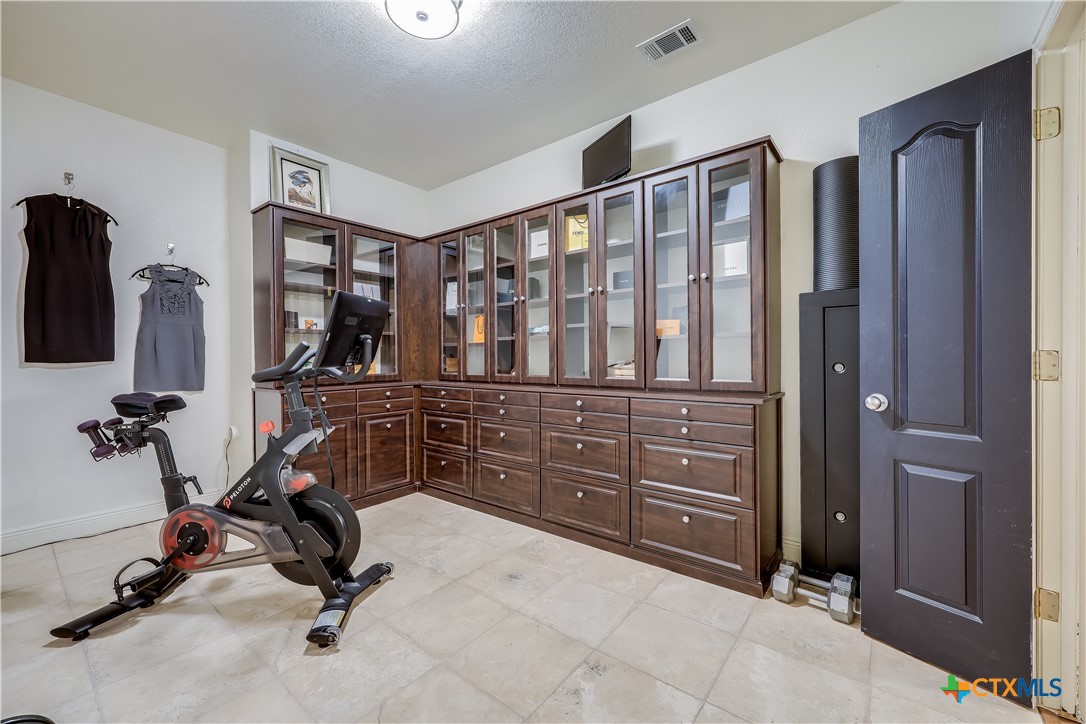 1307 Osprey Ridge Loop Lago Vista, TX 78645 - Photo 27 of 40 a view of a livingroom with furniture and a window