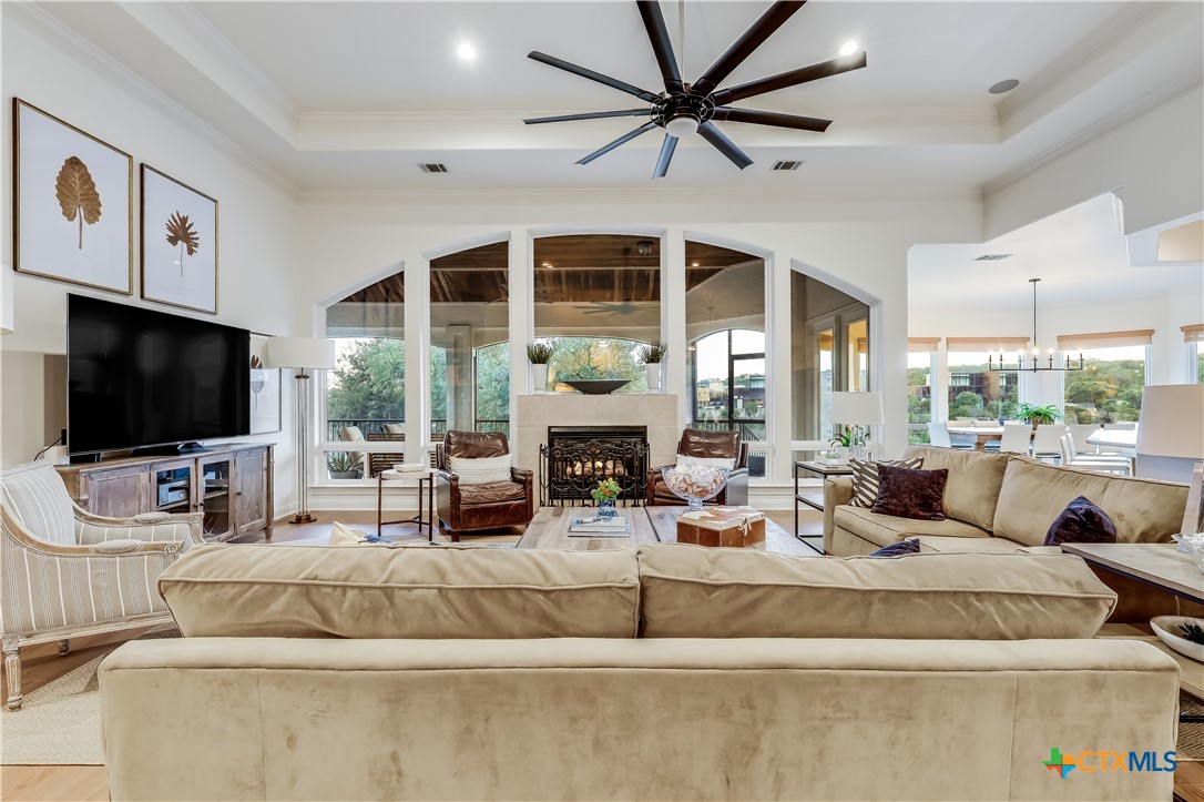 1307 Osprey Ridge Loop Lago Vista, TX 78645 - Photo 3 of 40 a living room with fireplace furniture and a flat screen tv