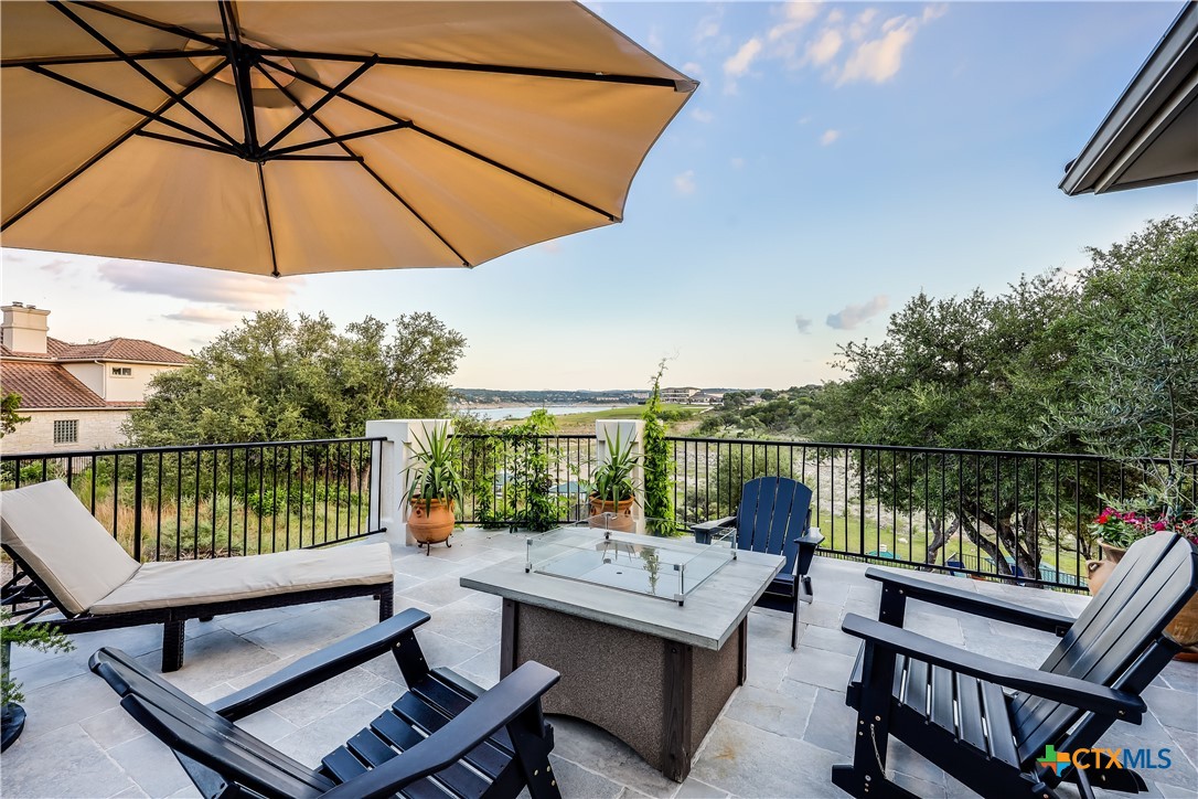 1307 Osprey Ridge Loop Lago Vista, TX 78645 - Photo 33 of 40 a view of a lake with couches in patio