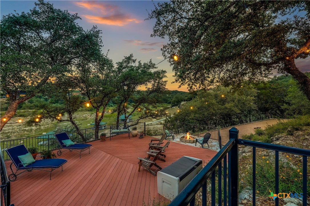 1307 Osprey Ridge Loop Lago Vista, TX 78645 - Photo 34 of 40 a view of a deck with two chairs and a table