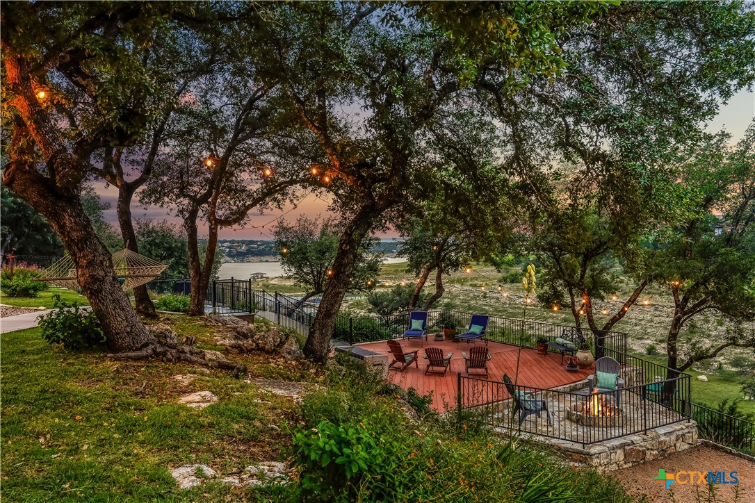 1307 Osprey Ridge Loop Lago Vista, TX 78645 - Photo 35 of 40 a backyard of a house with lots of green space
