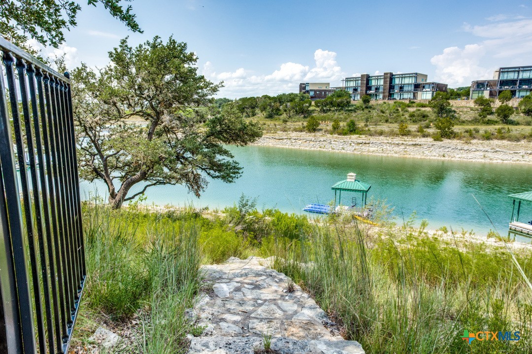 1307 Osprey Ridge Loop Lago Vista, TX 78645 - Photo 40 of 40 a view of a lake with a yard