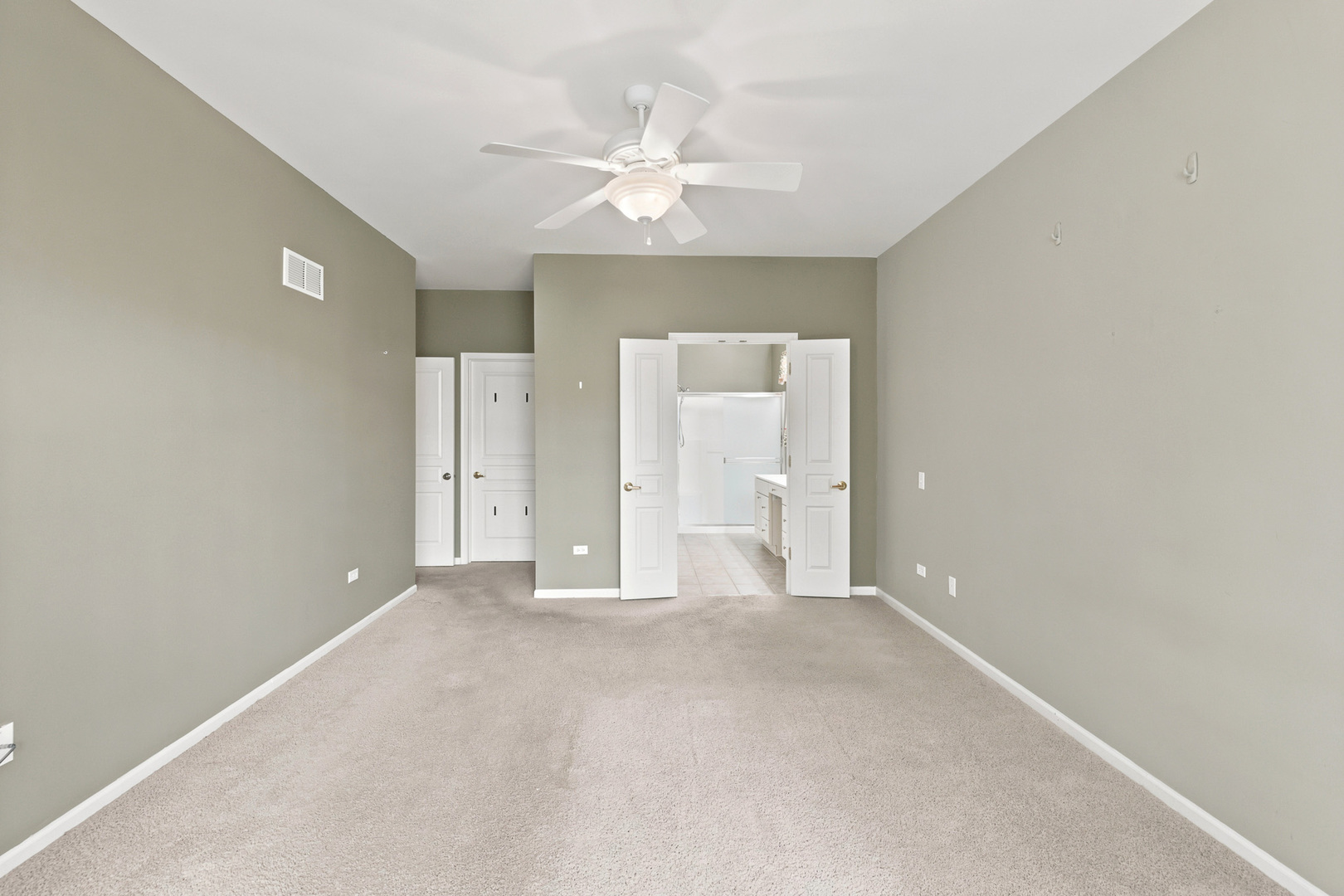 11923 Harrison Road Huntley, IL 60142 - Photo 19 of 38 an empty room with a ceiling fan and closet area