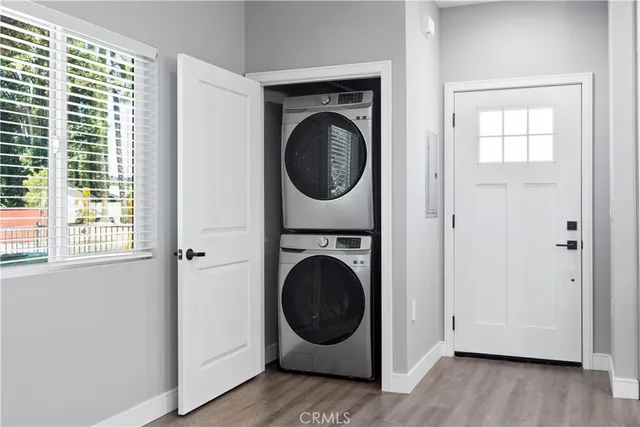 a view of a hallway with washer and dryer