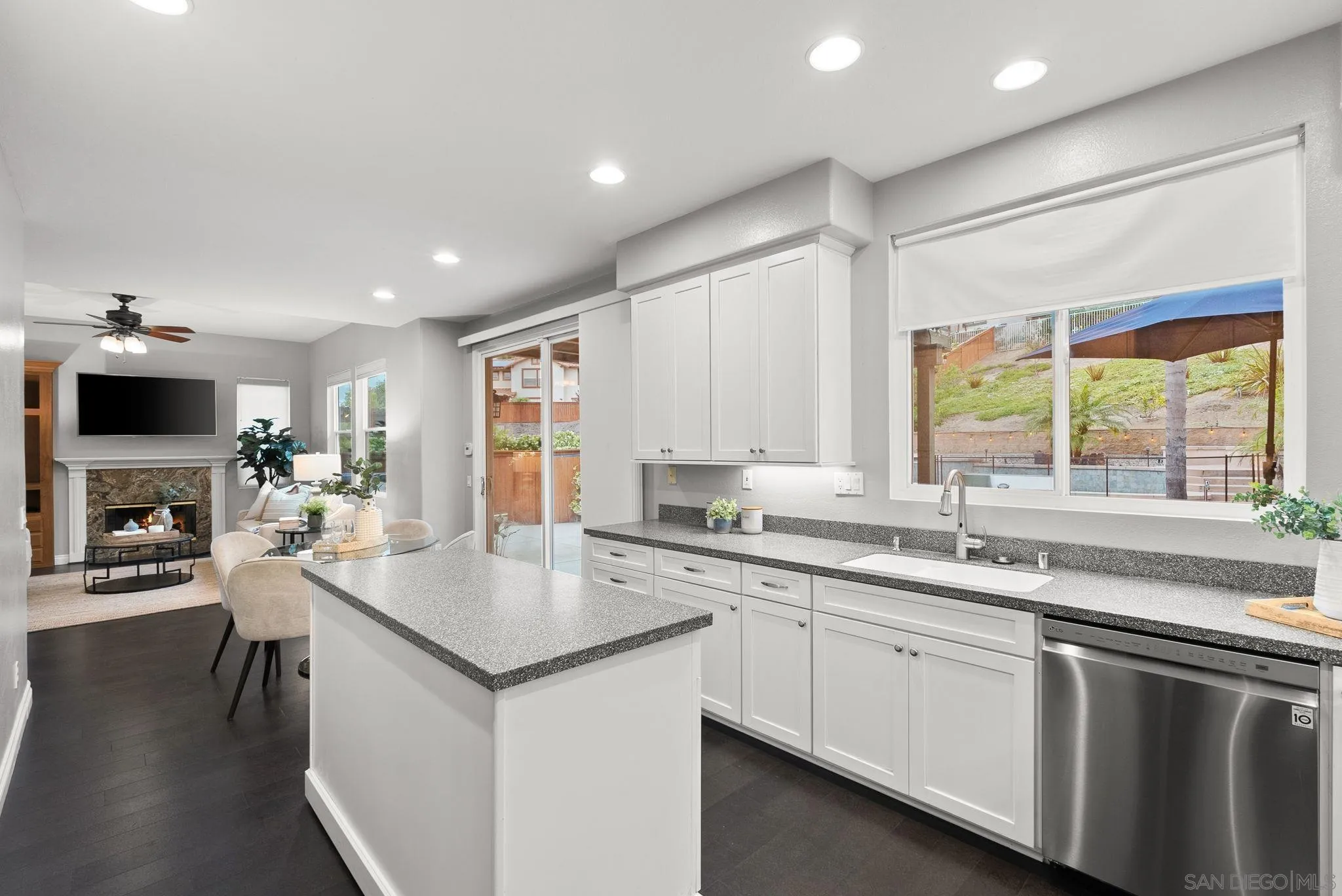 735 River Rock Road Chula Vista, CA 91914 - Photo 16 of 53 a kitchen with a sink stove and cabinets