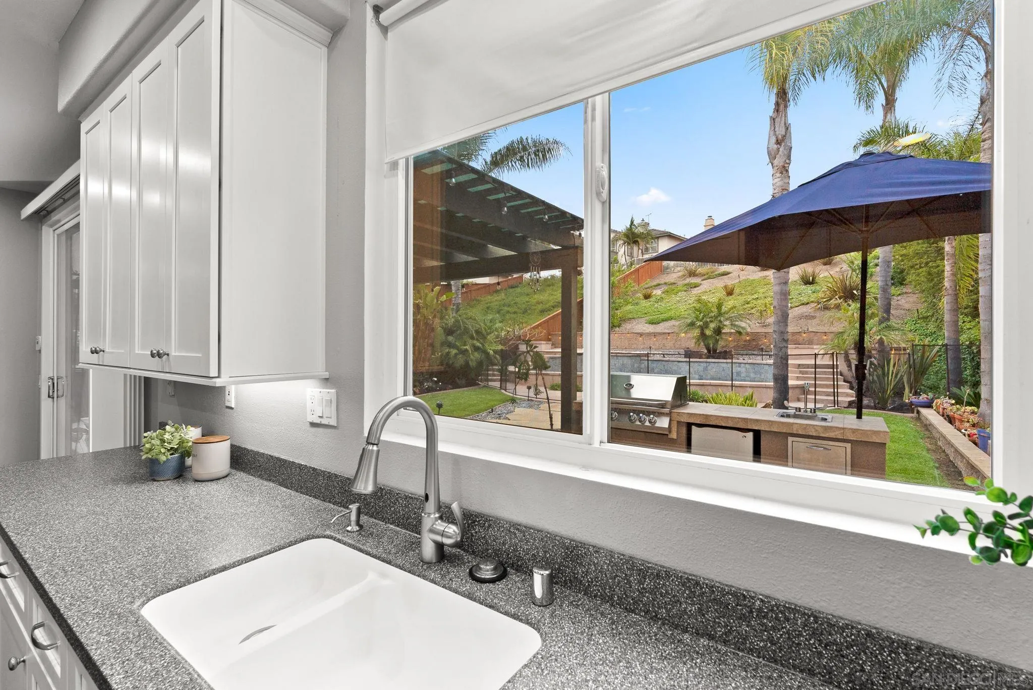 735 River Rock Road Chula Vista, CA 91914 - Photo 17 of 53 a kitchen with a sink and a large window