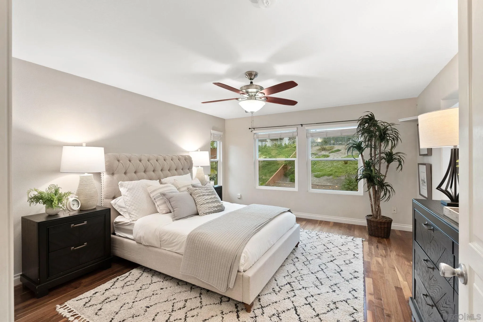 735 River Rock Road Chula Vista, CA 91914 - Photo 20 of 53 a bedroom with a large bed and a chandelier