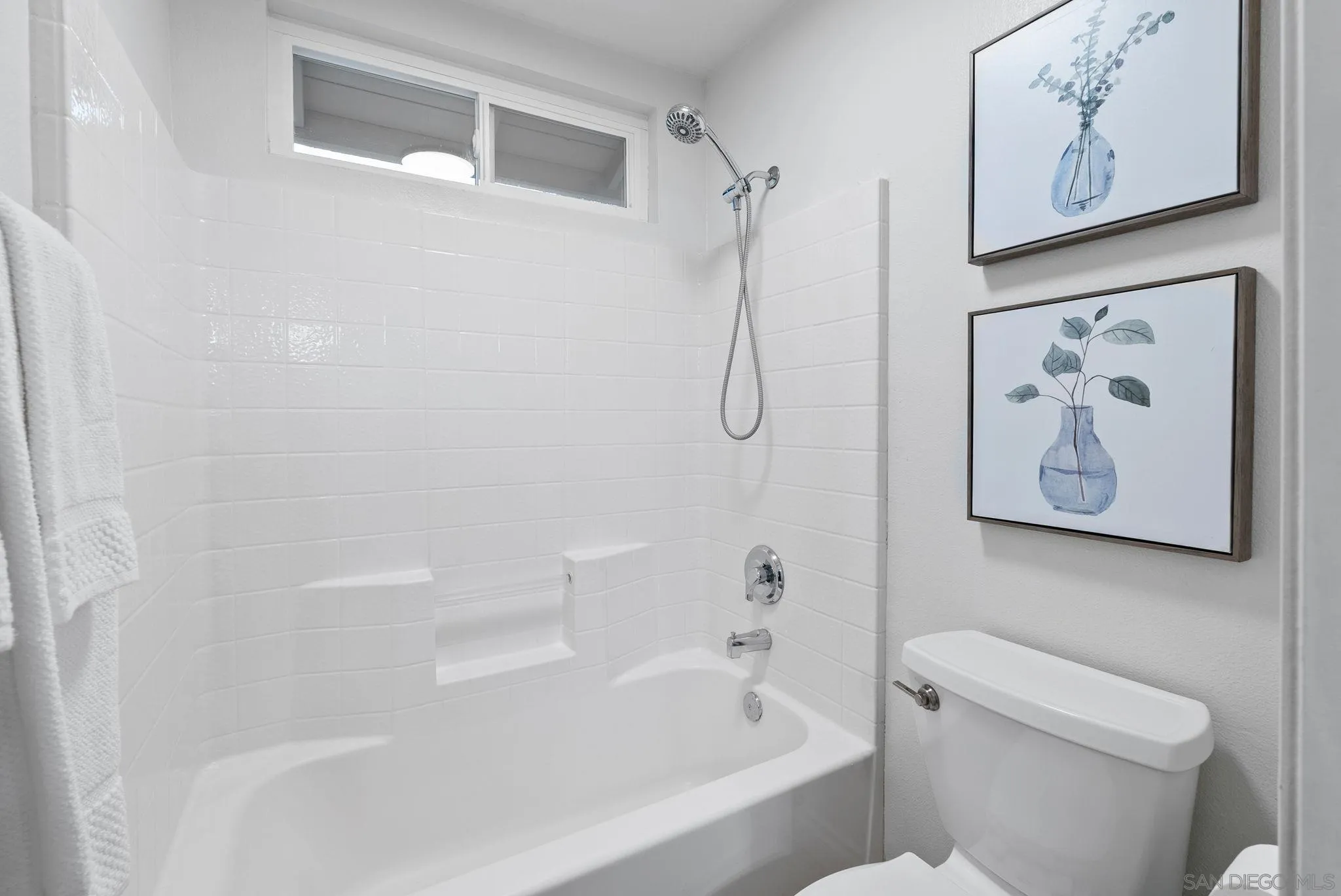 735 River Rock Road Chula Vista, CA 91914 - Photo 28 of 53 a white bath tub sitting next to a white toilet and vanity