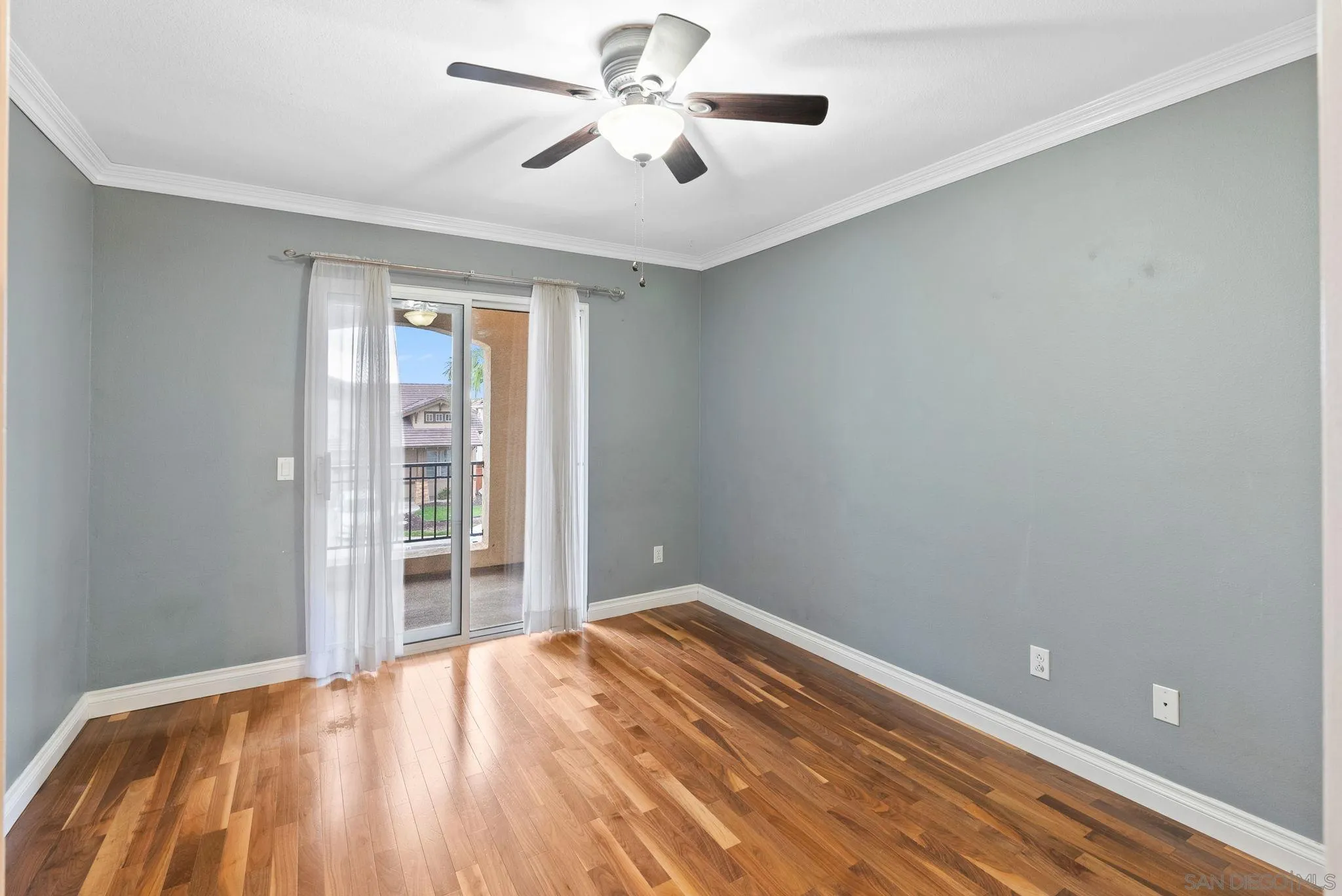 735 River Rock Road Chula Vista, CA 91914 - Photo 30 of 53 a view of empty room with wooden floor and fan