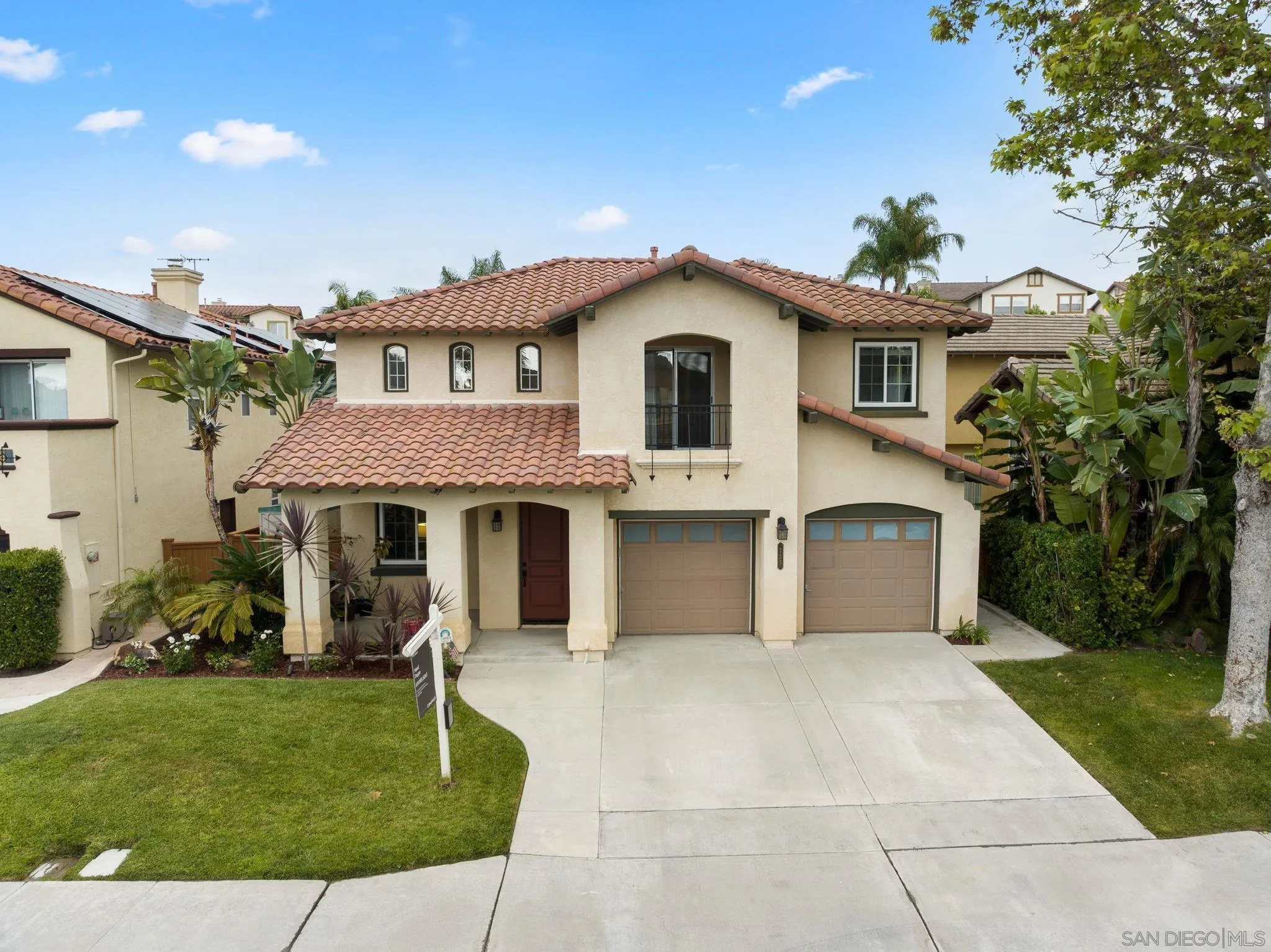 735 River Rock Road Chula Vista, CA 91914 - Photo 3 of 53 a front view of a house with a garden
