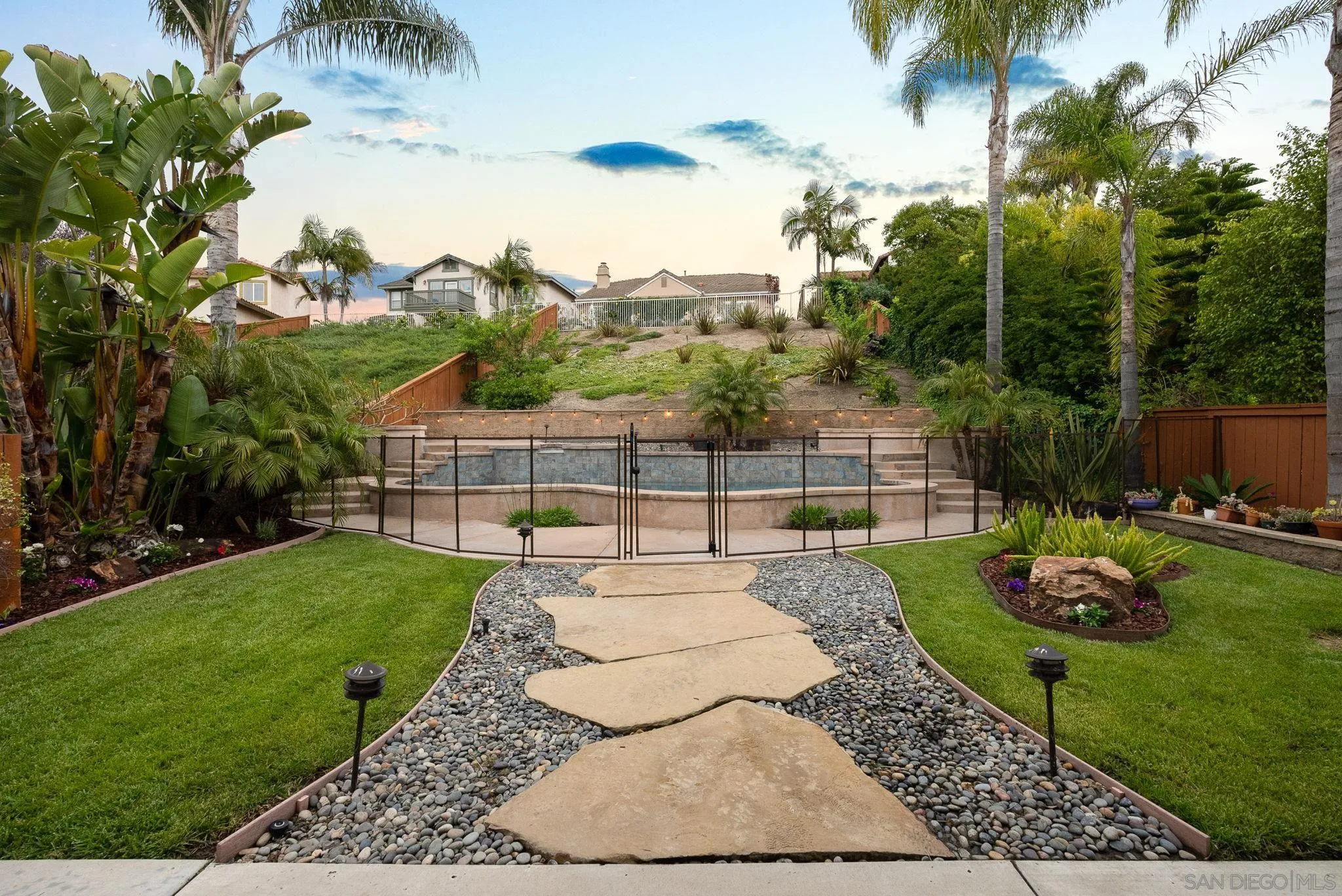 735 River Rock Road Chula Vista, CA 91914 - Photo 37 of 53 a view of a backyard with couches plants and swimming pool