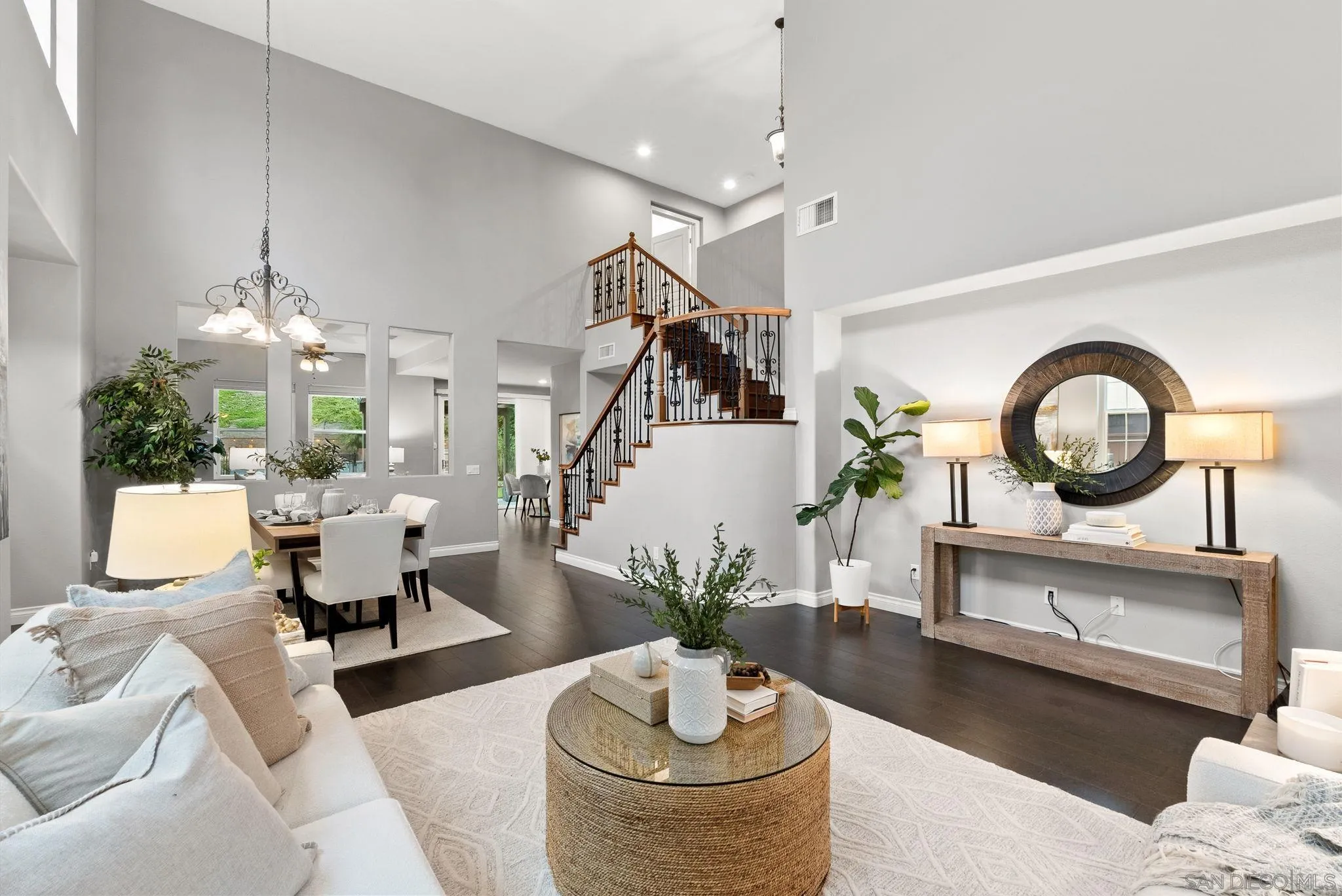 735 River Rock Road Chula Vista, CA 91914 - Photo 7 of 53 a living room with furniture a chandelier and a fireplace