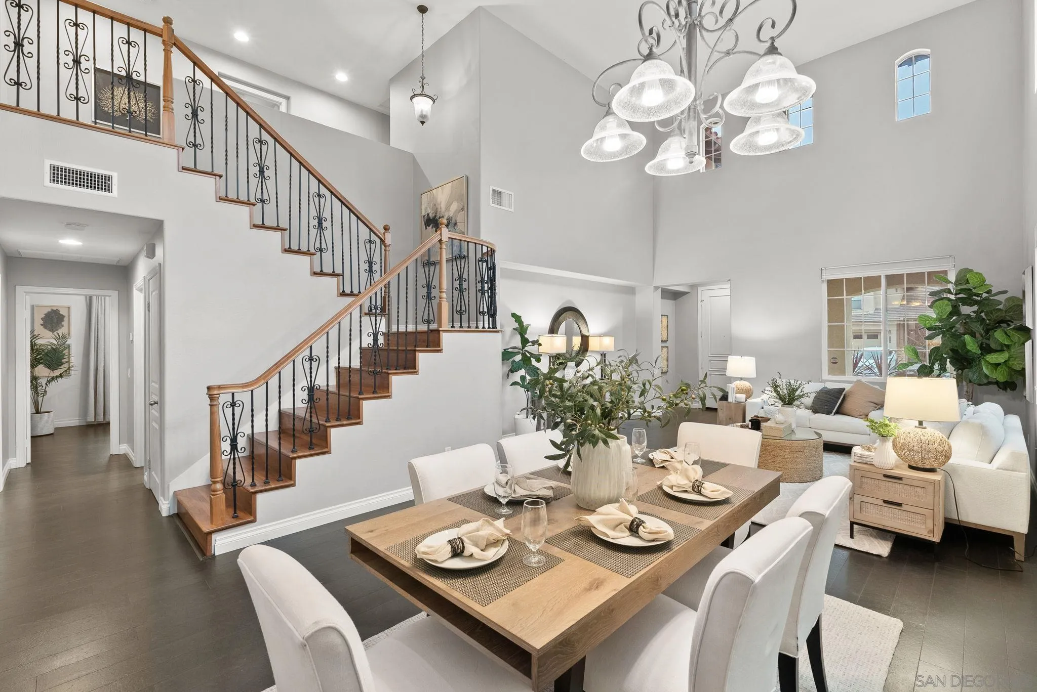 735 River Rock Road Chula Vista, CA 91914 - Photo 10 of 53 a view of a dining room with furniture a chandelier and wooden floor