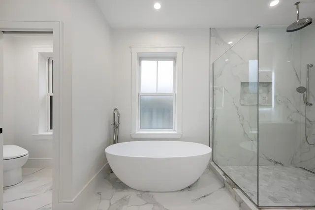 a bathroom with a sink vanity and mirror