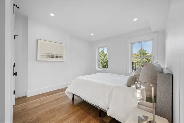 a bedroom with a bed and window