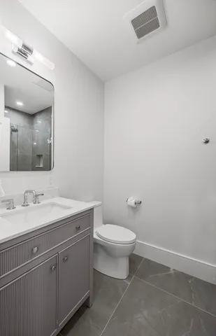 a front view of a building with garden