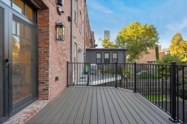 a view of a brick house with a large window