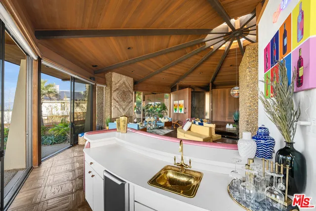 a room with furniture and a large window