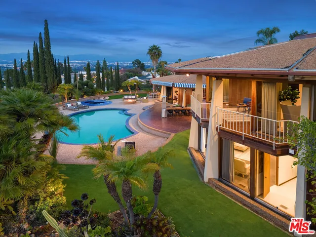 a view of a swimming pool with a patio