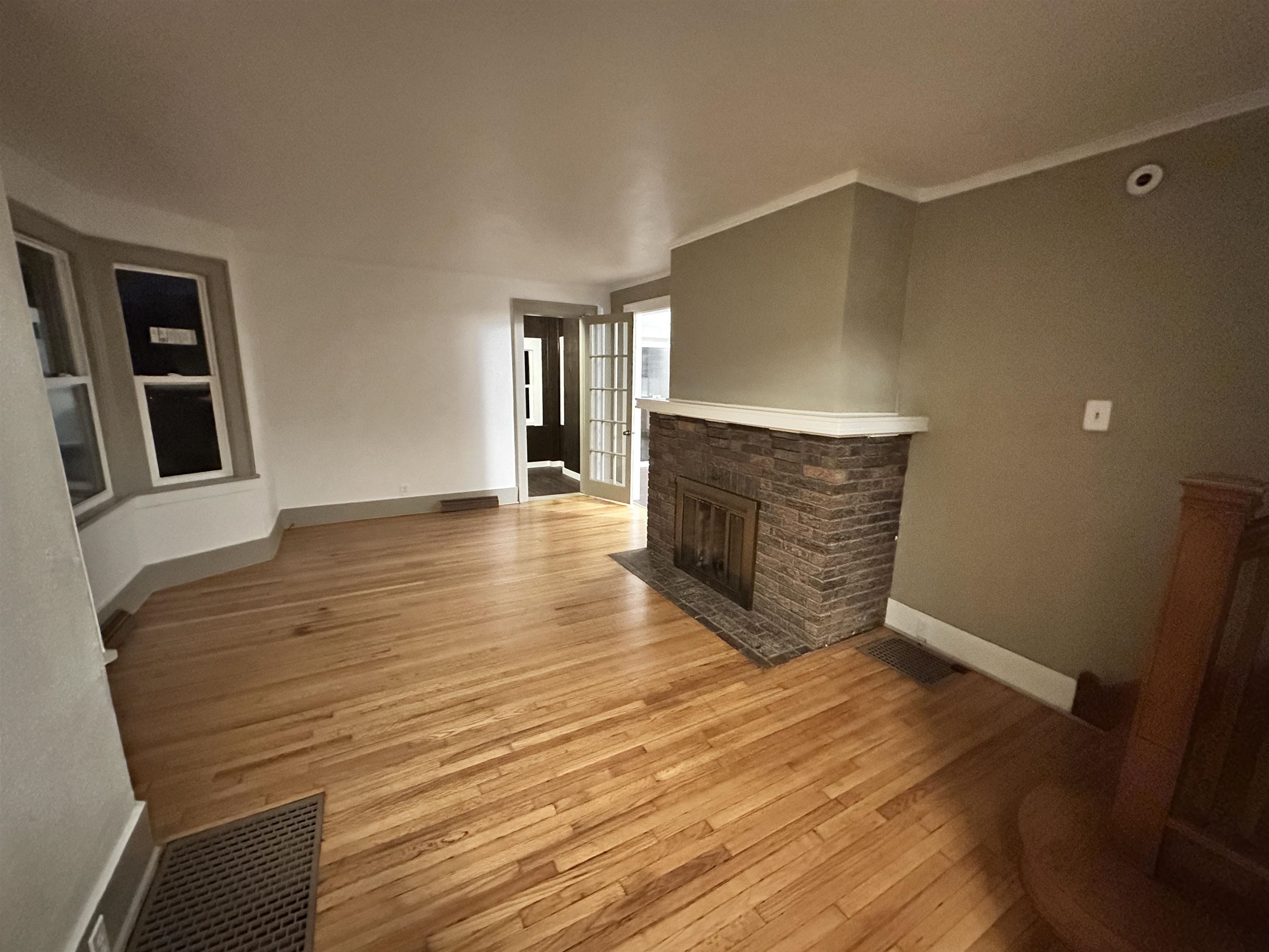 816 South Harlem Avenue Freeport, IL 61032 - Photo 13 of 33 a view of an empty room with wooden floor and staircase