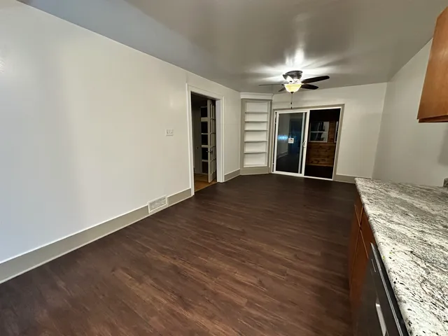 a view of a livingroom with wooden floor