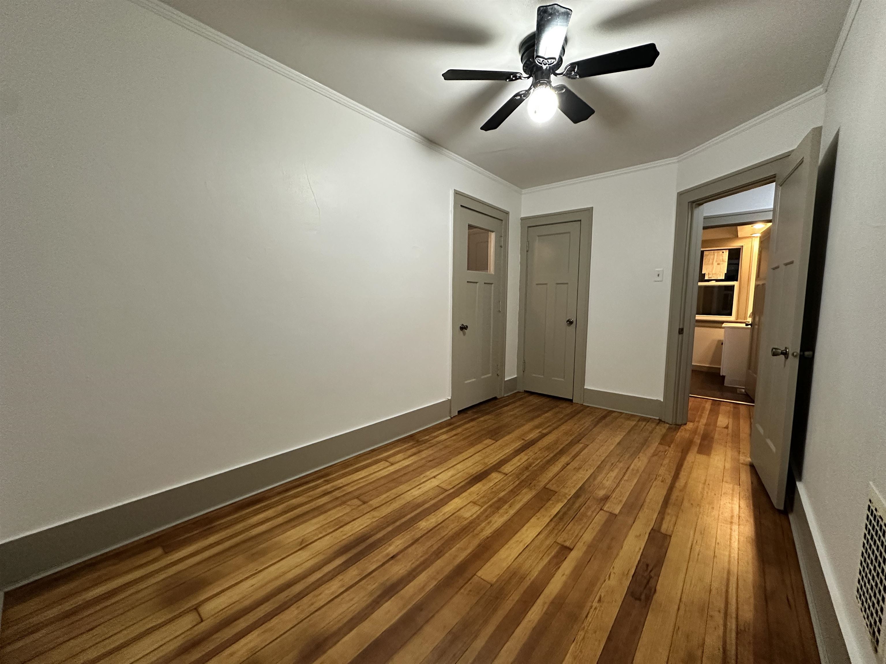 816 South Harlem Avenue Freeport, IL 61032 - Photo 29 of 33 a view of empty room with wooden floor
