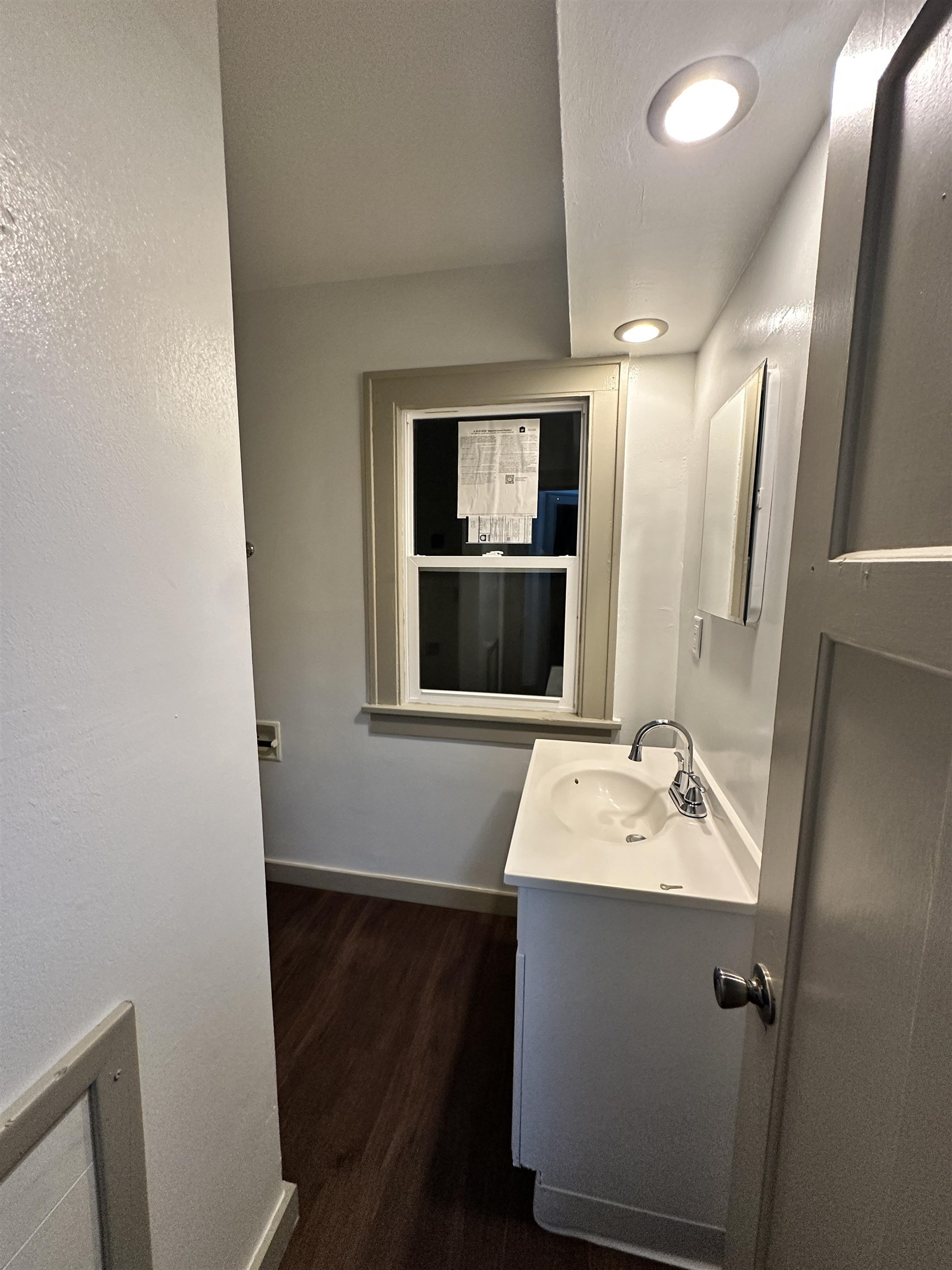 816 South Harlem Avenue Freeport, IL 61032 - Photo 32 of 33 a bathroom with a sink a mirror and vanity