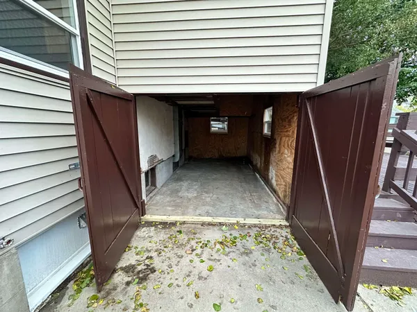 a view of a porch with wooden floor and stairs