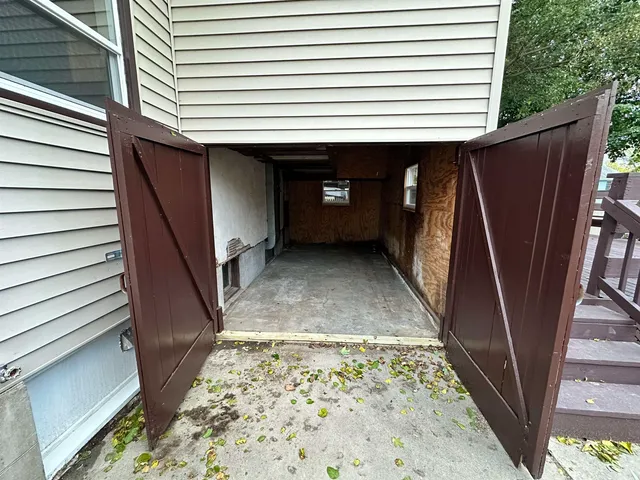 a view of a porch with wooden floor and stairs