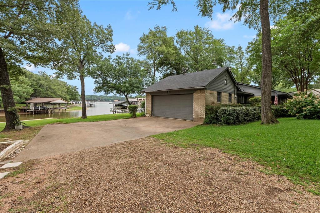 111 Deer Island Road Mabank, TX 75156 - Photo 5 of 26 The home offers attached two car garage, also access to private boat launch.