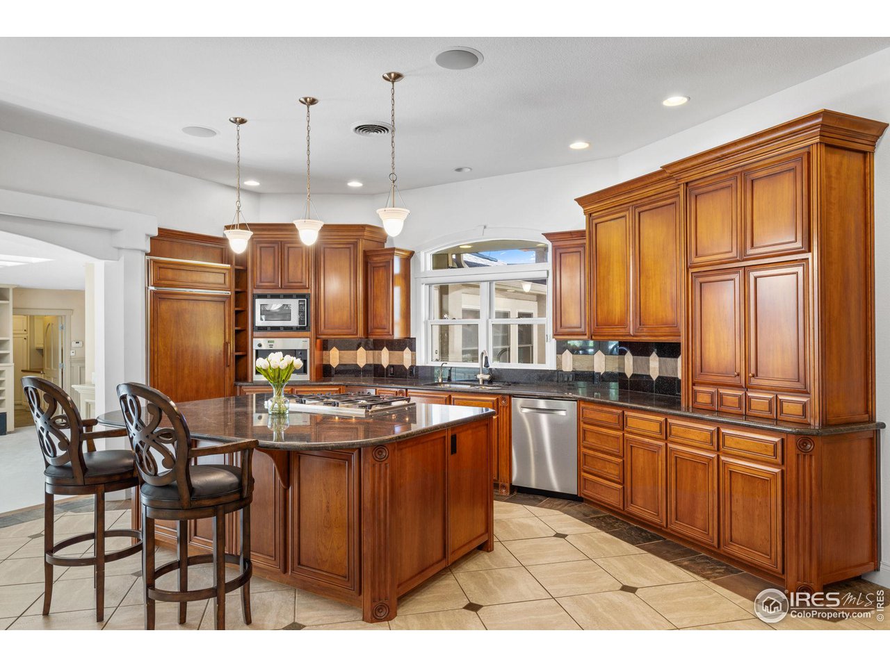 2210 Meadow Avenue Boulder, CO 80304 - Photo 13 of 40 a kitchen with stainless steel appliances granite countertop a sink and cabinets
