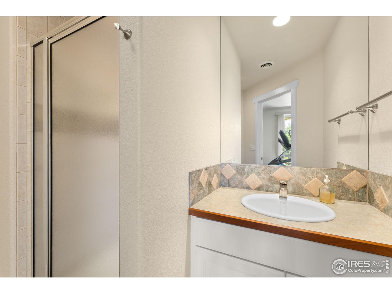 2210 Meadow Avenue Boulder, CO 80304 - Photo 22 of 40 a bathroom with a sink and a mirror