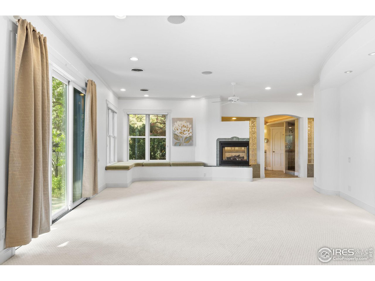 2210 Meadow Avenue Boulder, CO 80304 - Photo 23 of 40 a view of an empty room with a fireplace and a window