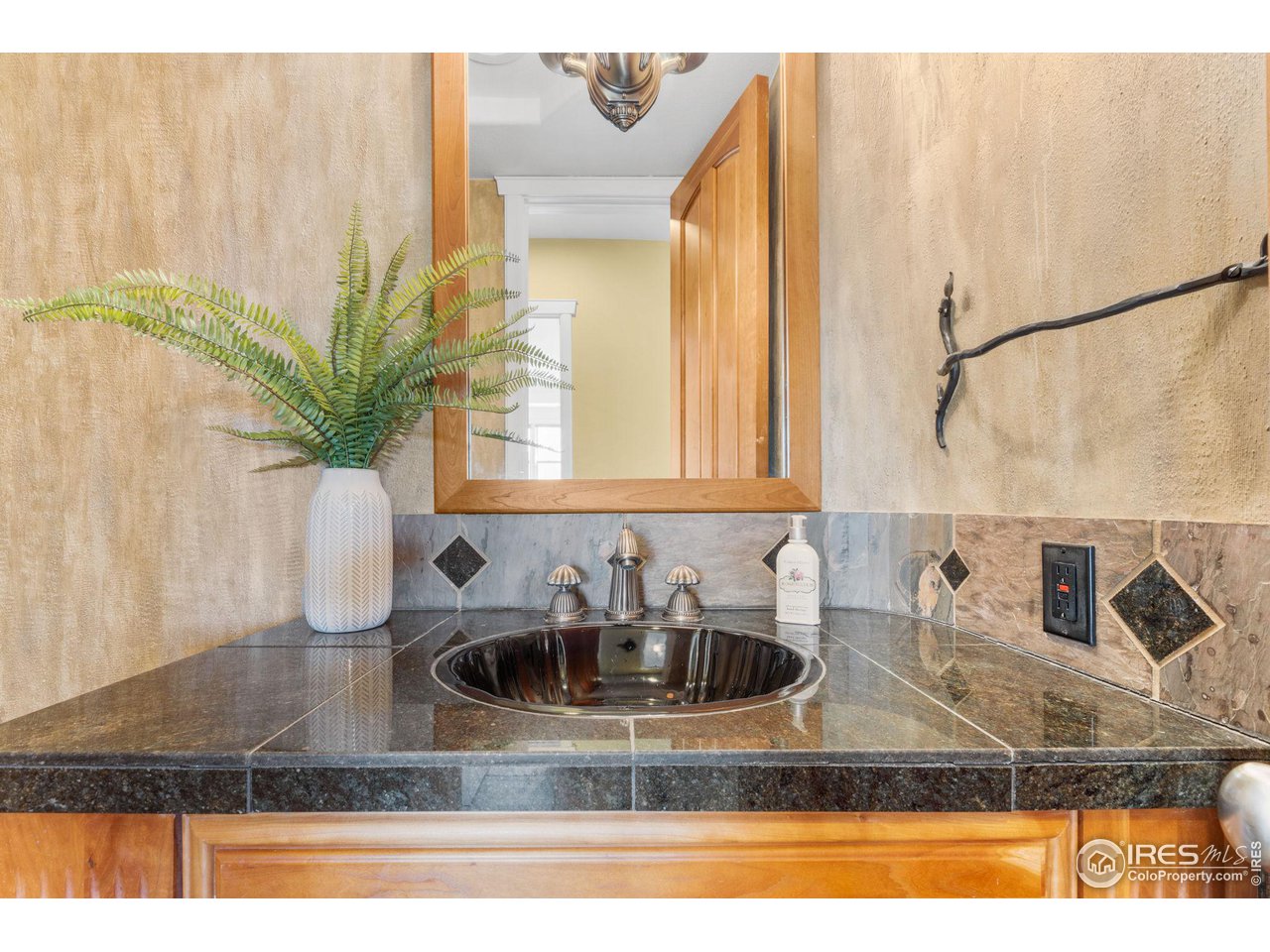 2210 Meadow Avenue Boulder, CO 80304 - Photo 28 of 40 a kitchen with kitchen island a sink a counter top space and cabinets