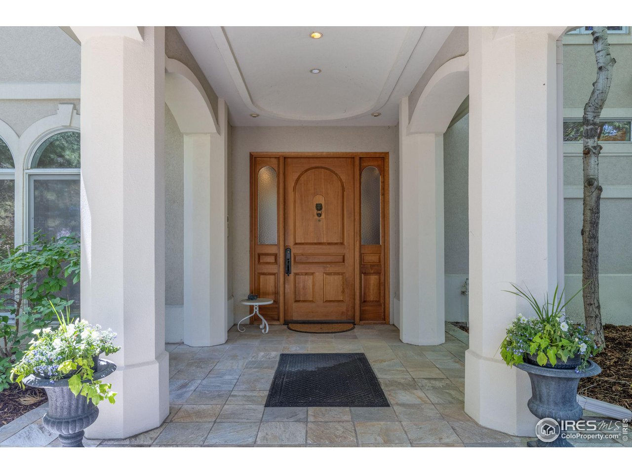 2210 Meadow Avenue Boulder, CO 80304 - Photo 7 of 40 a view of a hallway with entryway and potted plants