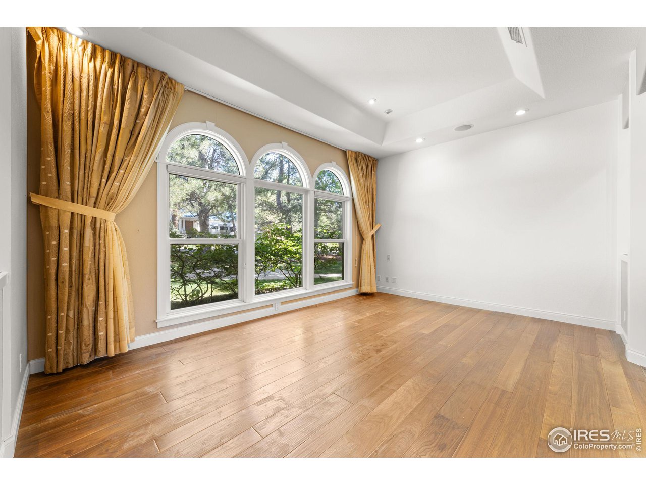 2210 Meadow Avenue Boulder, CO 80304 - Photo 10 of 40 a view of an empty room with wooden floor and a window